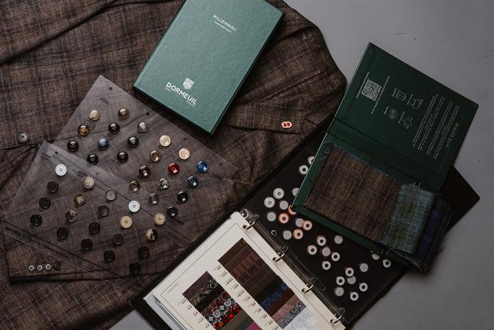 Fabric, buttons, and swatch books laid out for a Sorek custom build