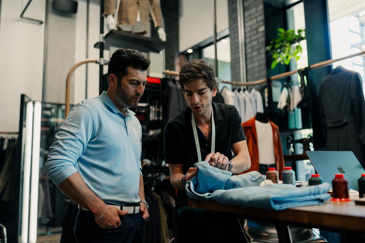 Sorek stylist reviewing fabric options with a client
